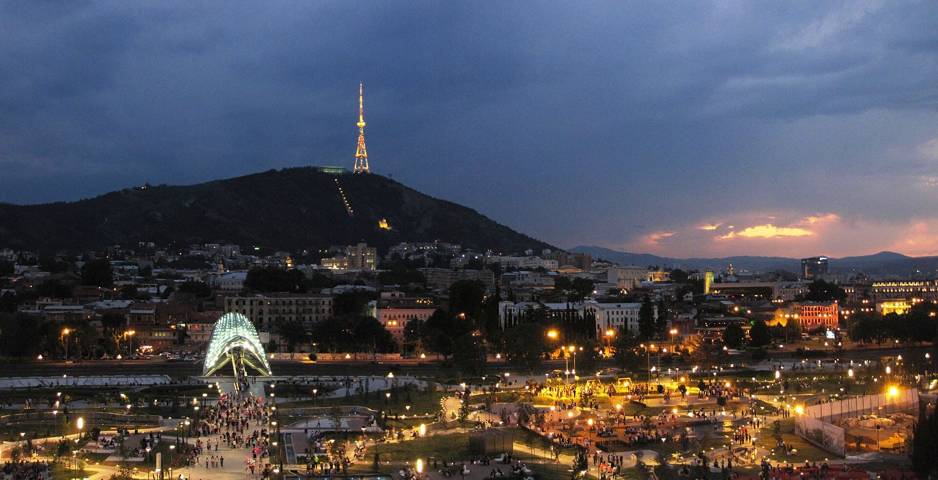 Tbilisi at dusk with the Peace Bridge lit